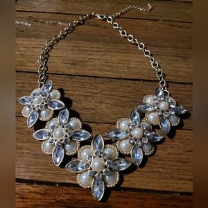 Bejeweled and pearled necklace.